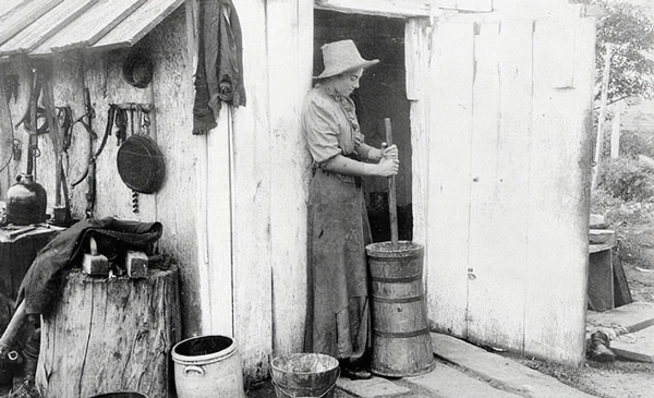 a woman churn butter
